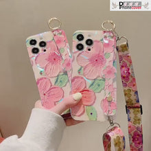 Load and play video in Gallery viewer, New Oil Painting Flower Wristband iPhone Case with Messenger Rope
