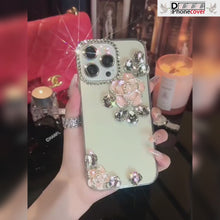 Load and play video in Gallery viewer, Luxury Camellia Diamond Transparent iPhone case
